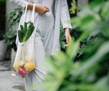 Woman with a full of vegetables bag